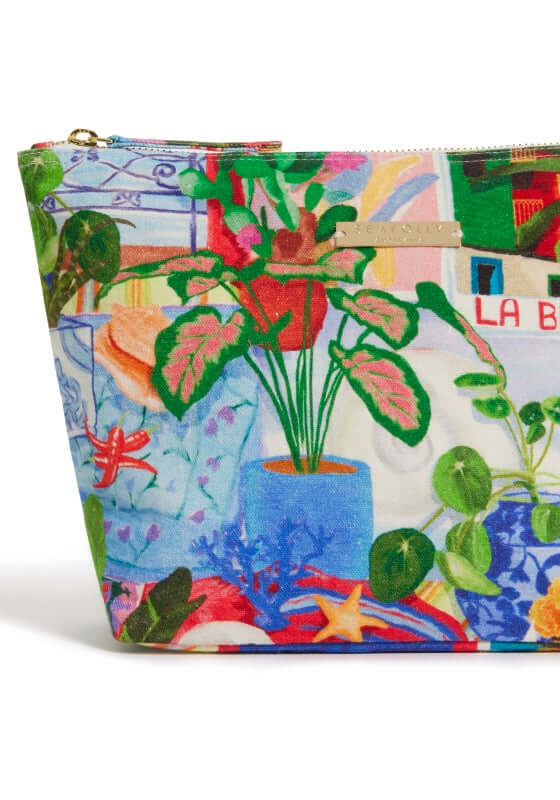 La Boca Beach Pouch by Seafolly featuring a colorful design with plants and vibrant patterns, ideal for beach days.