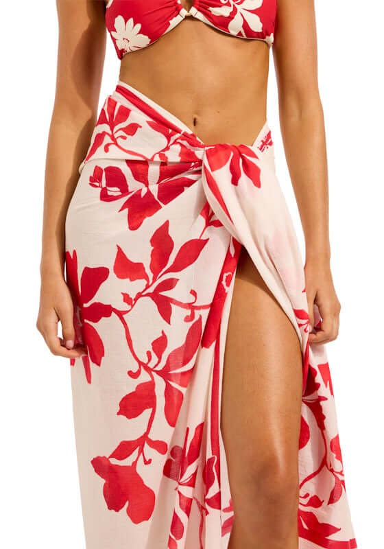 Mayflower Sarong Cosmo Red by Seafolly worn by a model showcasing vibrant red floral print against an ecru background.