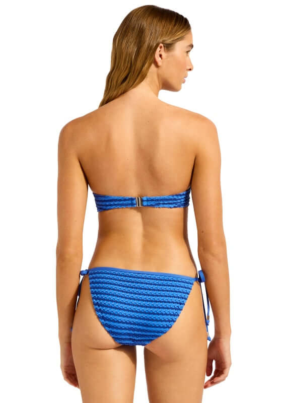 Mesh Effect Tie Side Bottoms Sapphire by Seafolly. Model shows back view of blue tie side bikini bottoms.