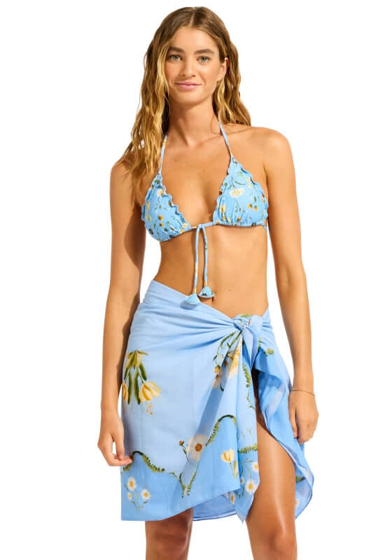 Modern Romance Sarong Powder Blue by Seafolly, featuring a model in a chic blue sarong and bikini by the pool.