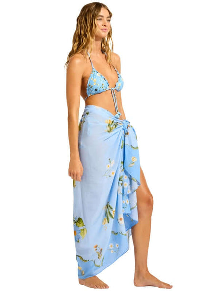 Modern Romance Sarong Powder Blue by Seafolly styled on model at the beach, showcasing its vibrant floral print.