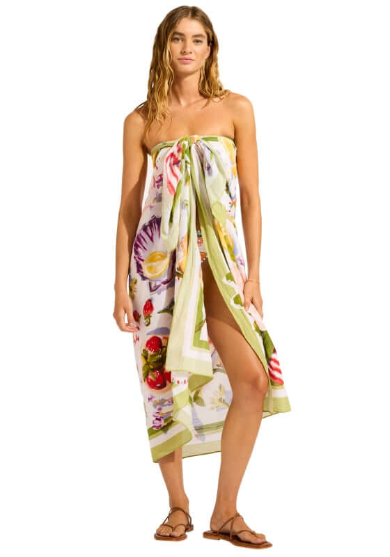 Riviera Coast Sarong by Seafolly, a model showcasing a colorful floral sarong styled elegantly.