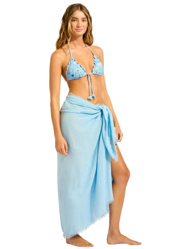 Textured Wrap Sarong Cornflower Blue by Seafolly worn as a cover-up over a bikini, perfect for beach and poolside.