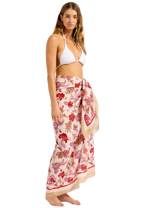 Summerchintz Sarong Ecru by Seafolly, model wearing floral sarong as a cover-up over swimwear.