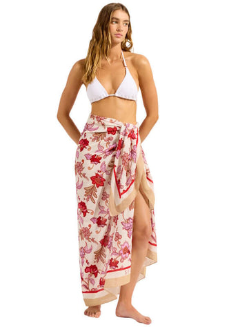 Summerchintz Sarong Ecru by Seafolly, a model showcasing the lightweight floral wrap on a beach.