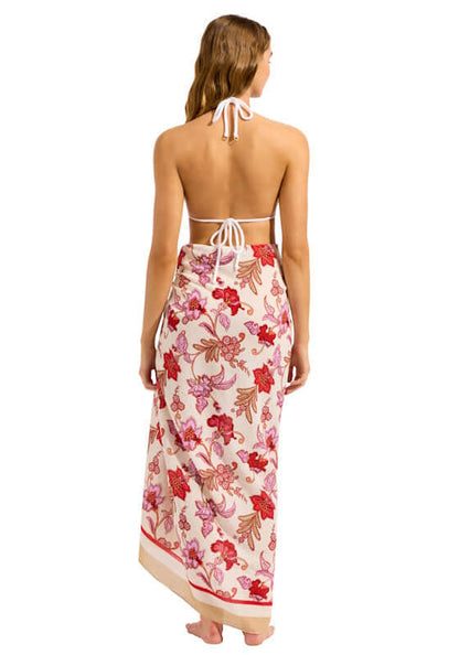 Summerchintz Sarong Ecru by Seafolly, featuring a floral design draped elegantly over a model at the beach.