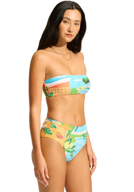Sunset Bandeau Bikini by Seafolly, featuring a turquoise bandeau top and high-waisted bottom with a colorful print.