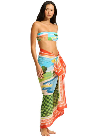 Sunset Sarong by Seafolly, model wearing a colorful aquatic print sarong styled for beach wear.