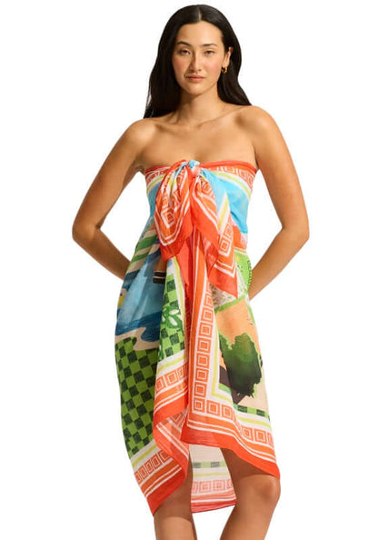 Sunset Sarong by Seafolly, model wearing a vibrant printed sarong with stunning coastal designs.