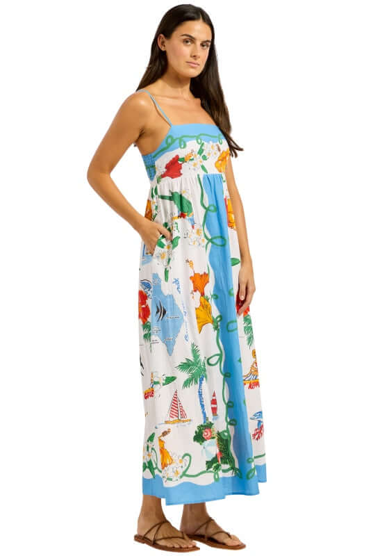 Viva Vacation Maxi Dress by Seafolly, a model wearing a colorful maxi dress with seaside print.
