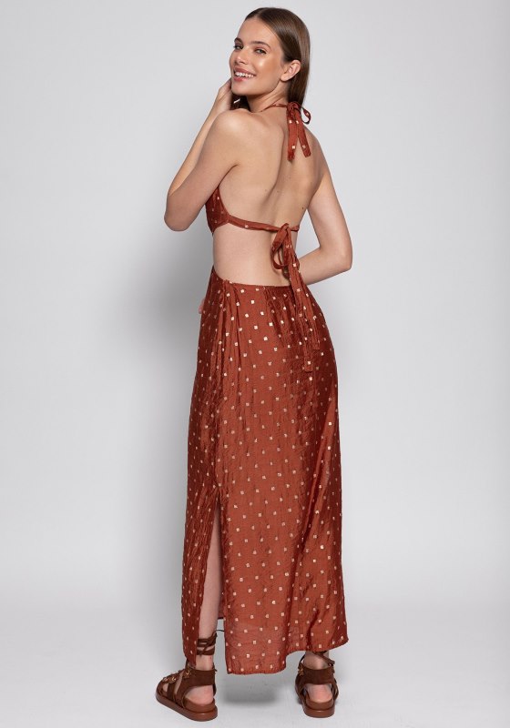 Filiza Dress by Sundress features a brown and gold polka dot print, halter ties, and cut out sides for summer elegance.