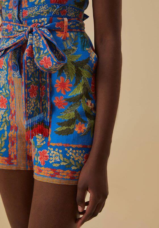 Stiched Garden Blue Romper by Farm Rio featuring colorful floral patterns and a stylish silhouette.