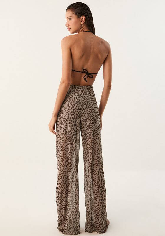 Pareo Beach Trousers Barths by Vix Swimwear, featuring a model wearing lightweight, animal print trousers from behind.