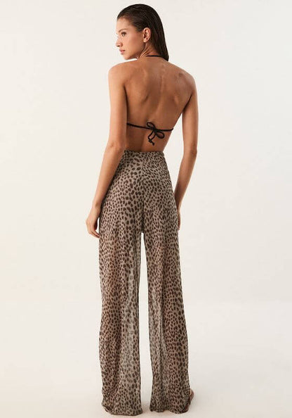 Pareo Beach Trousers Barths by Vix Swimwear, featuring a model wearing lightweight, animal print trousers from behind.
