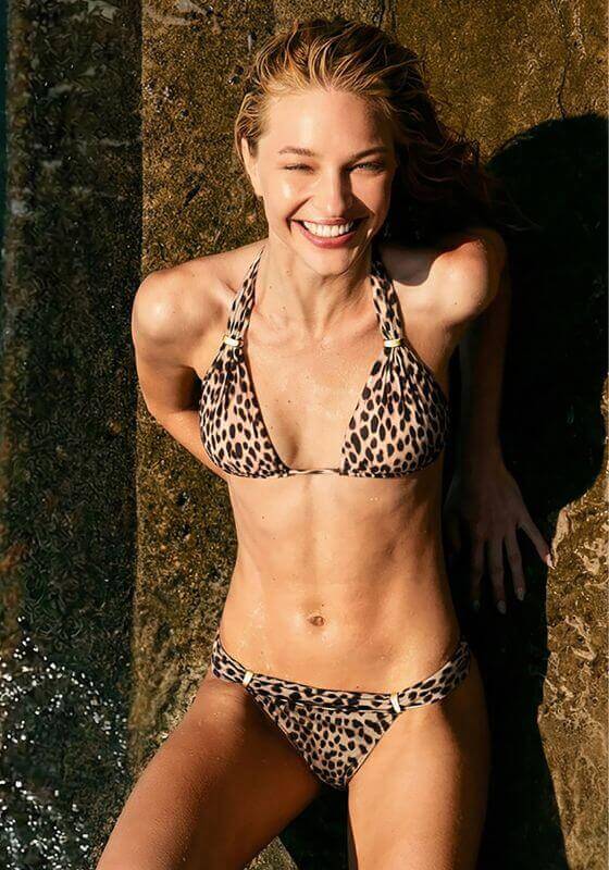 Barths Bia Bikini by Vix Swimwear, model in bold animal print bikini enjoying the outdoors, featuring gold details.
