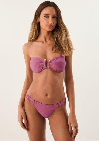 Dune Floraline Jill Square Bandeau Bikini by Vix Swimwear model showcasing a stylish bandeau bikini in a pink hue.