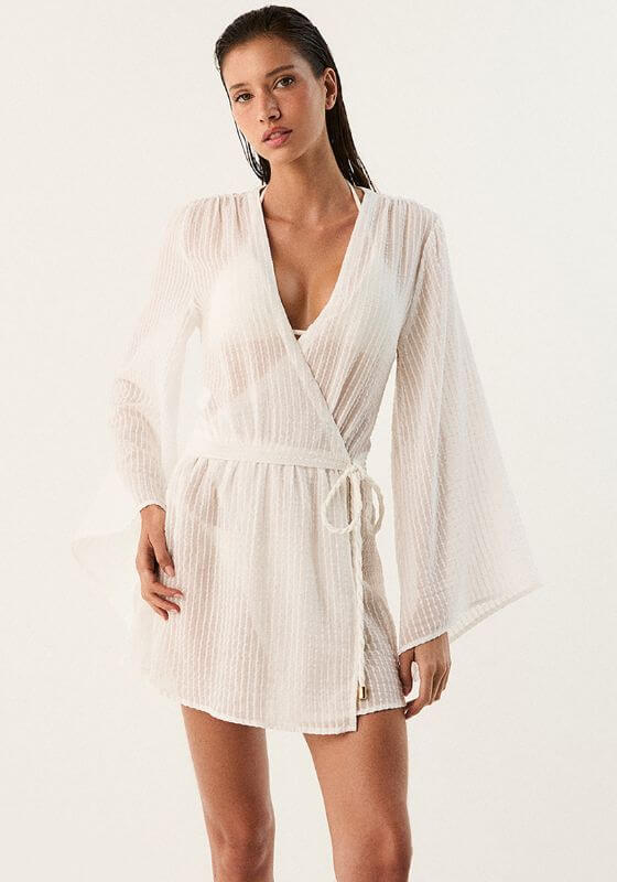 Winnie Short Cover Up by Vix Swimwear, a lightweight off-white kaftan with floaty sleeves and adjustable tie waist.