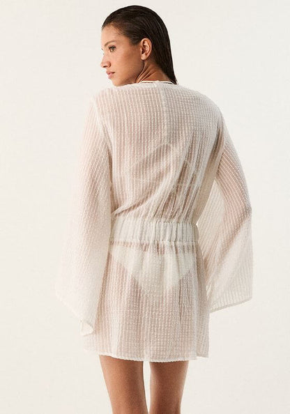 Winnie Short Cover Up by Vix Swimwear, lightweight off-white kaftan with floaty sleeves and adjustable tie waist.