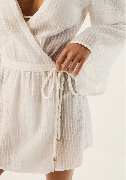 Winnie Short Cover Up by Vix Swimwear featuring a tie wrap waist and elegant floaty sleeves in soft off-white fabric.